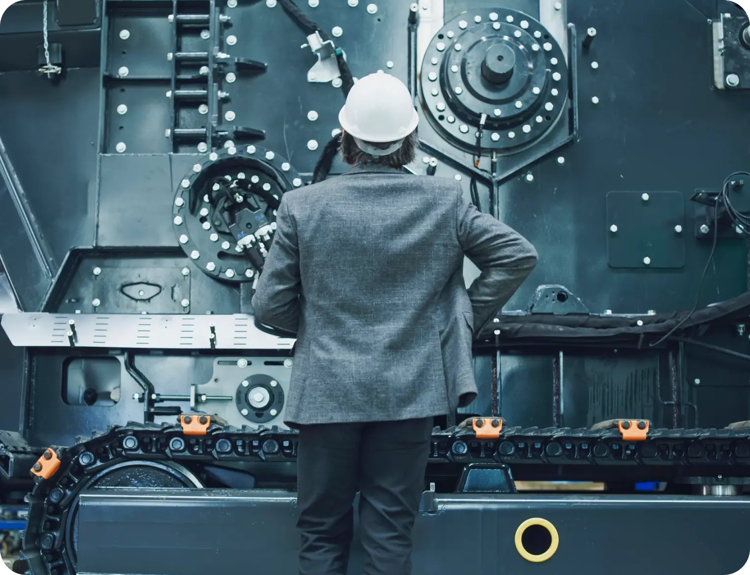 Engineer inspecting industrial machinery.